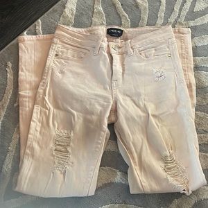 Light pink Bebe Distressed Skinny Jeans Size 25